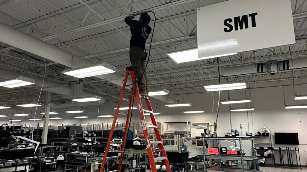 industrial electrician Massachusetts working on 480V panel